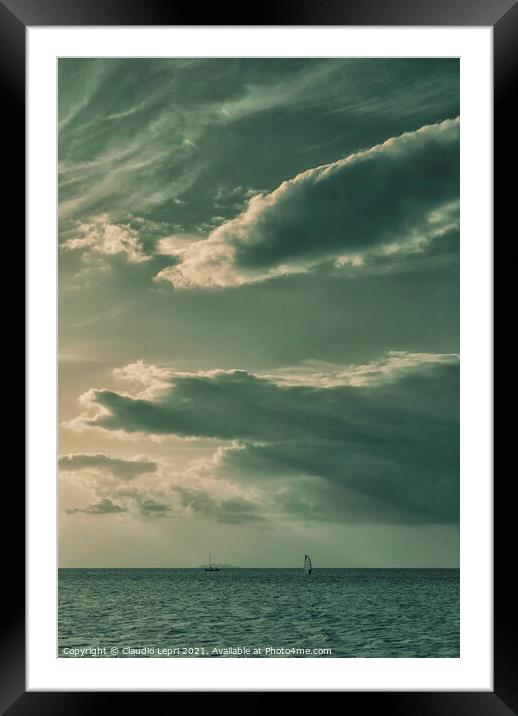 Sailing under cloudy sky Framed Mounted Print by Claudio Lepri