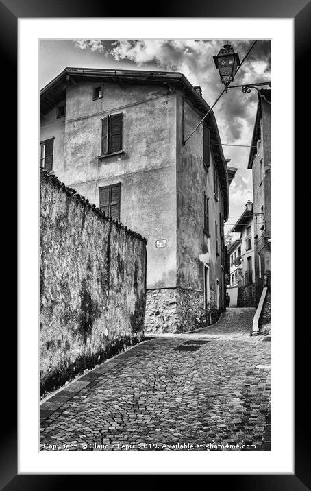 Crossing of alleys in alpine village, BW Framed Mounted Print by Claudio Lepri