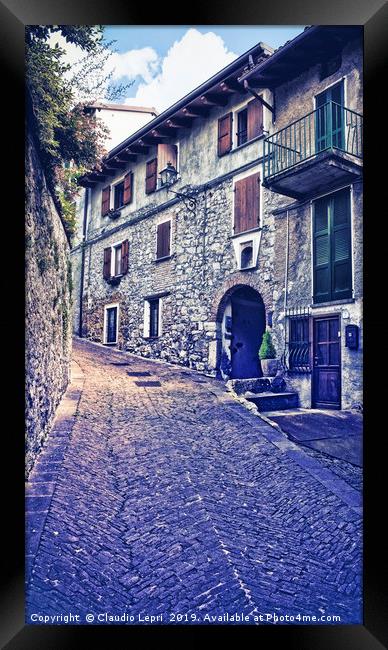 Alley in alpine village Framed Print by Claudio Lepri