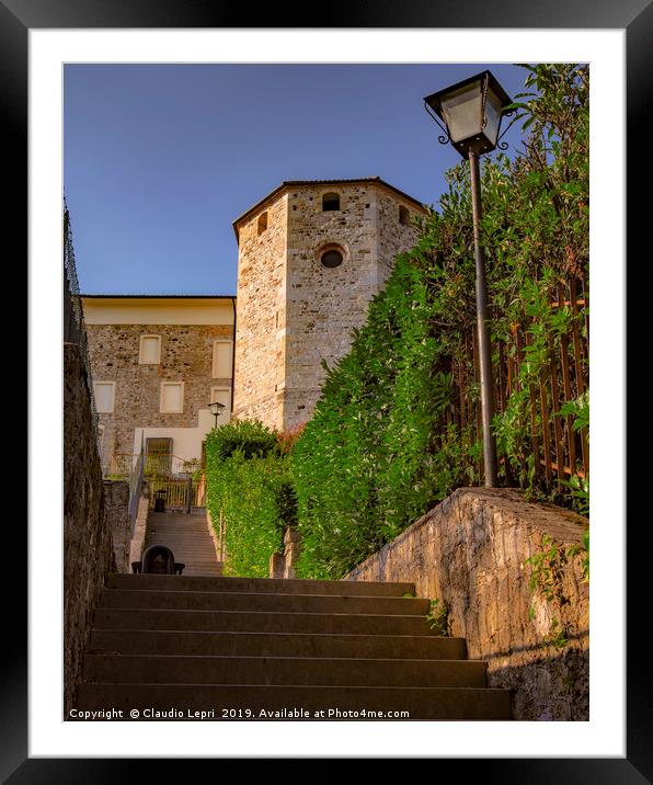 The tower is the apse of S.Mary church in S.Daniel Framed Mounted Print by Claudio Lepri