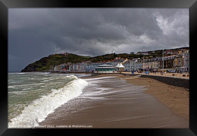 Aberystwyth on a stormy day with Constitution hill in the distance Framed Print by Jenny Hibbert