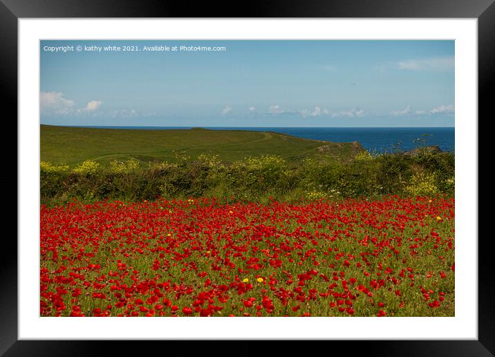 A field of red poppies with the ocean Framed Mounted Print by kathy white
