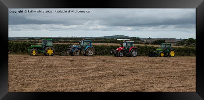 Tractors  in a Cornish field Framed Print by kathy white