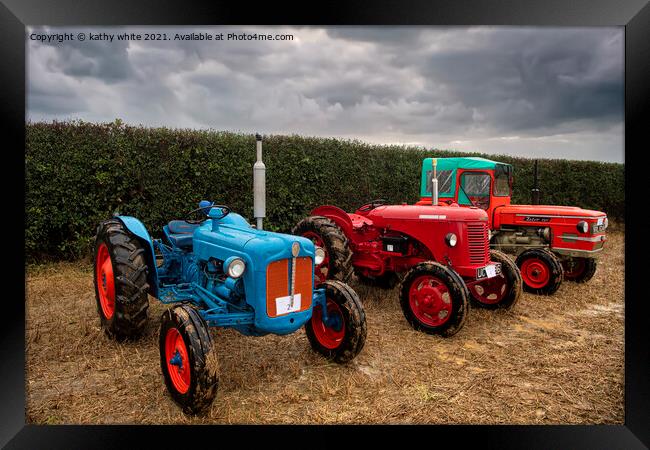 3 vintage Tractors  in a Cornish field Framed Print by kathy white