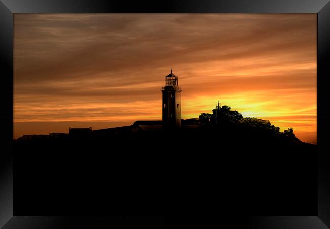 silhouette at sunset with orange sky Framed Print by kathy white