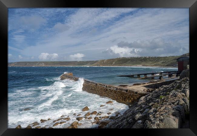 Sennen cove harbour on a stormy day Framed Print by kathy white