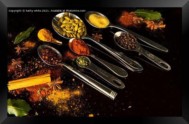 curry spice on a black background Framed Print by kathy white