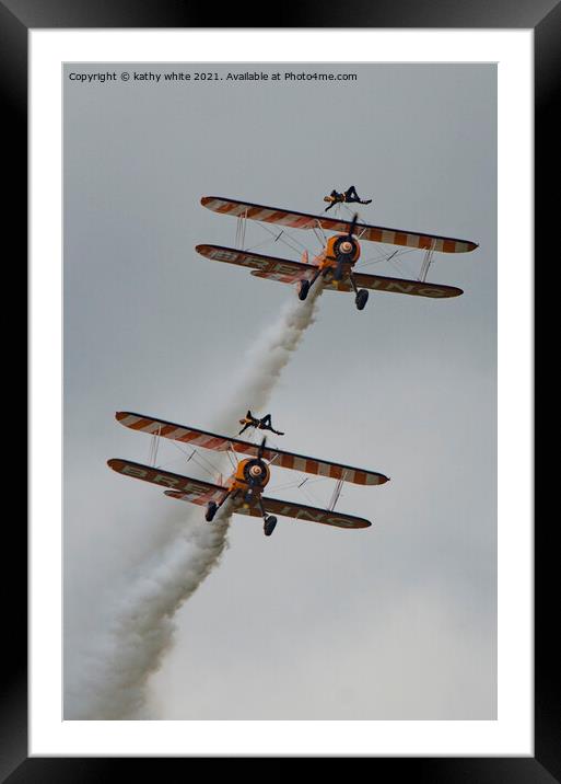 two women,walking on the wing of a plane Framed Mounted Print by kathy white