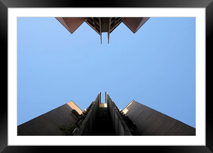 Looking up a brutalist building in Skopje Framed Mounted Print by Lensw0rld 