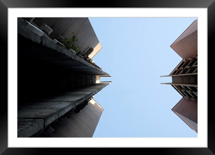 Looking up a brutalist building in Skopje Framed Mounted Print by Lensw0rld 
