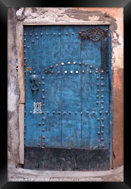 Ancient blue door in the old town of Marrakesh Framed Print by Lensw0rld 