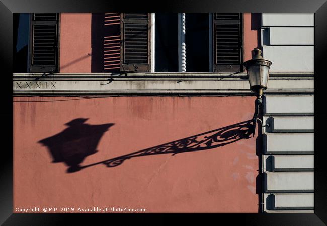 A street light in Rome throwing a long shadow Framed Print by Lensw0rld 