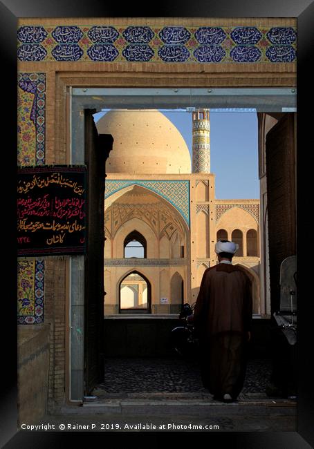 A man enters Agha Bozorg mosque Framed Print by Lensw0rld 