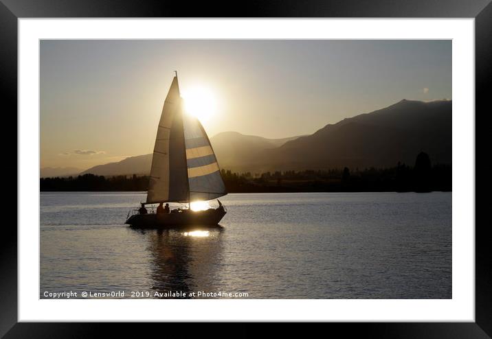 Sailing boat against the setting sun Framed Mounted Print by Lensw0rld 