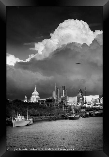 Stormy skies over the London skyline Framed Print by Justin Foulkes