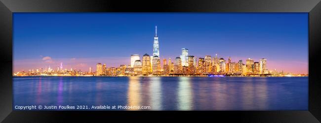 Lower Manhattan skyline at night, from New Jersey Framed Print by Justin Foulkes