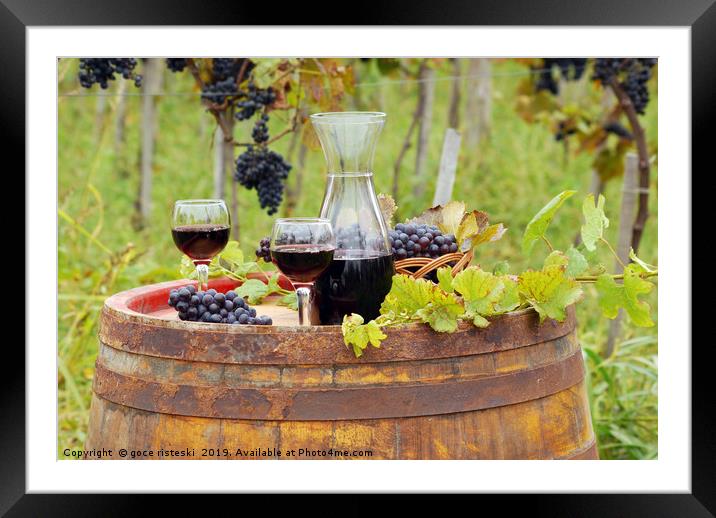 glasses and bottle with red wine in vineyard Framed Mounted Print by goce risteski