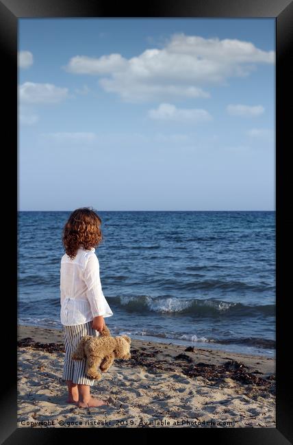 little girl with teddy bear on beach summer season Framed Print by goce risteski