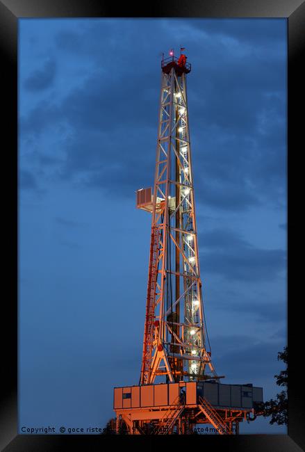 illuminated land oil drilling rig Framed Print by goce risteski