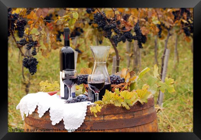 red wine and grape on wooden barrel Framed Print by goce risteski