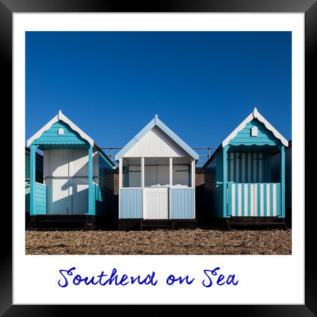 Southend Beach Hut Trio in Blue Framed Print by Dave Denby