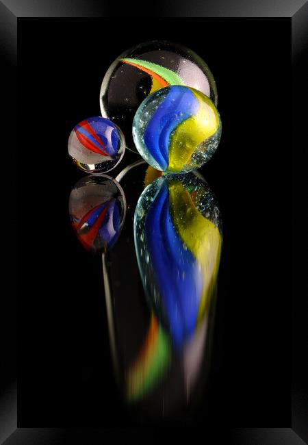Three colourfull marbles reflecting Framed Print by Tony Claes