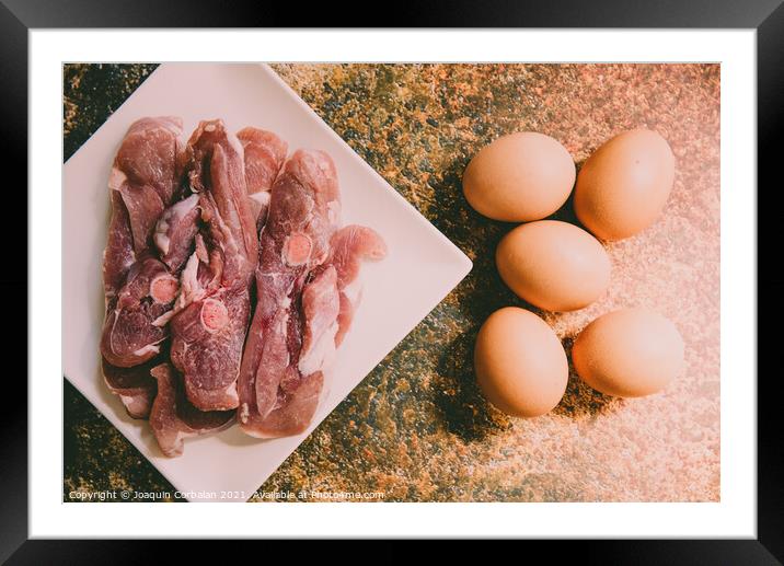 Raw meat and eggs for cooking Framed Mounted Print by Joaquin Corbalan