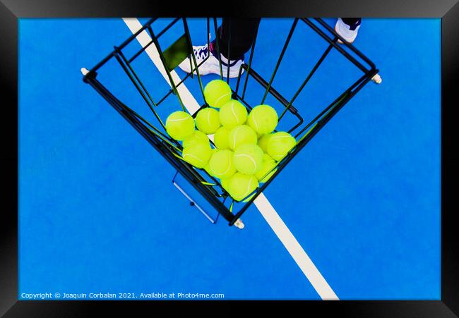 Basket full of yellow tennis balls for training tennis players o Framed Print by Joaquin Corbalan