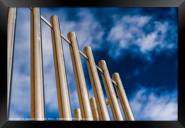 Metal bars protect an institutional building. Framed Print by Joaquin Corbalan