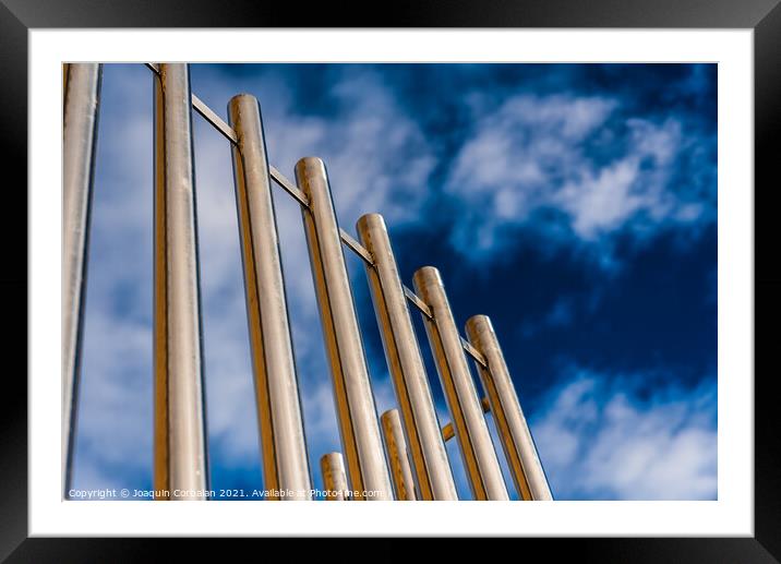 Metal bars protect an institutional building. Framed Mounted Print by Joaquin Corbalan