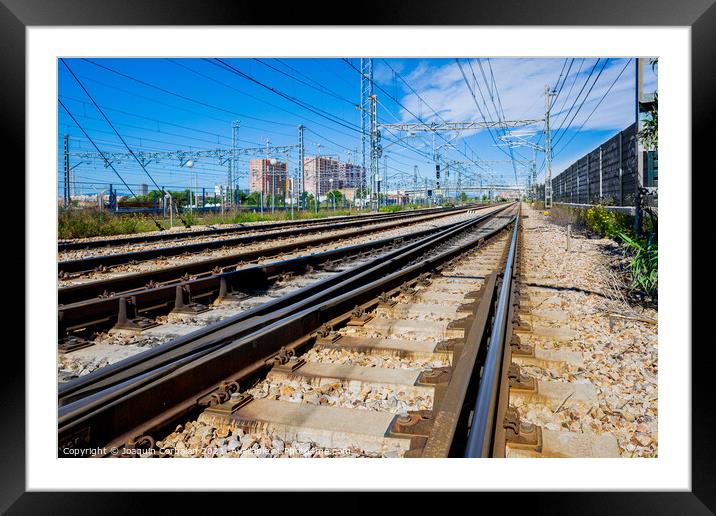 Electrified multi-lane railroa Framed Mounted Print by Joaquin Corbalan