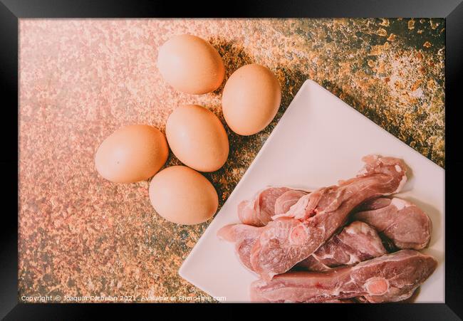 Healthy foods rich in animal protein, raw meat and eggs. Framed Print by Joaquin Corbalan