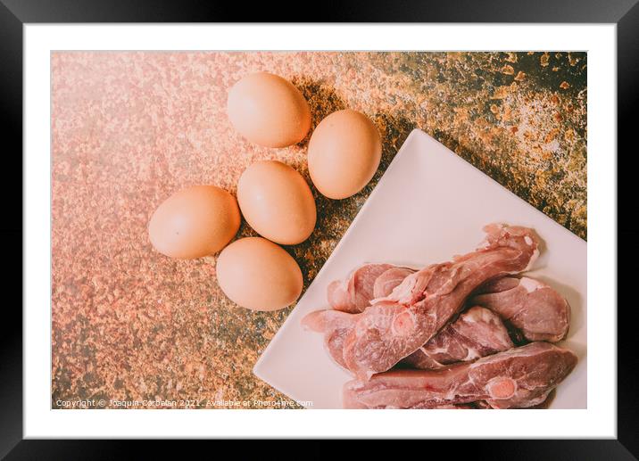 Healthy foods rich in animal protein, raw meat and eggs. Framed Mounted Print by Joaquin Corbalan