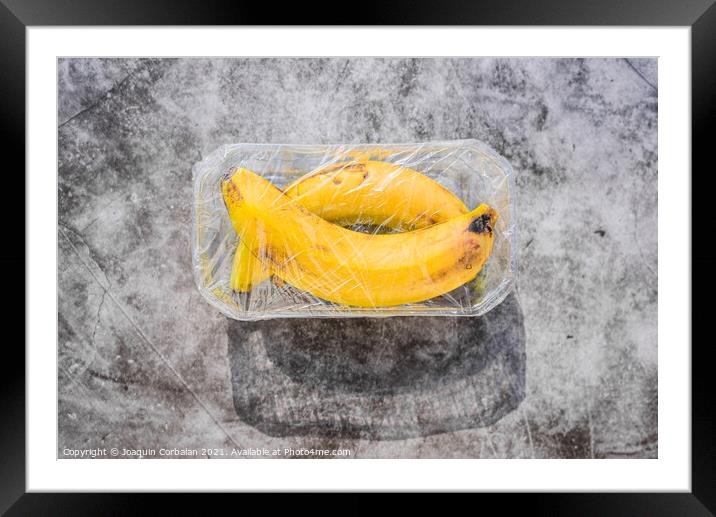 Plastic waste is unsustainable, polluting unnecessary fruit wrap Framed Mounted Print by Joaquin Corbalan