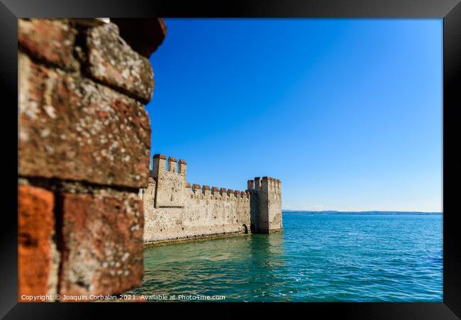 Facade of the castle of Sirmione surrounded by water. Framed Print by Joaquin Corbalan