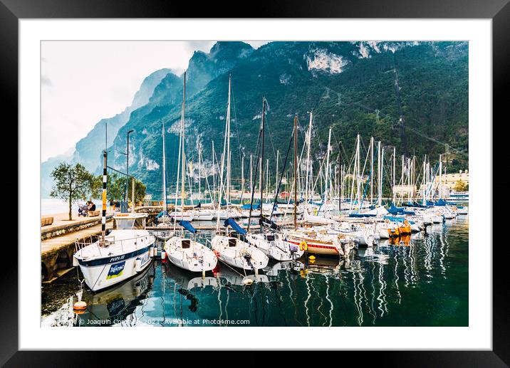 Riva del Garda, Italy - October 2, 2021: Boats and yachts moored Framed Mounted Print by Joaquin Corbalan