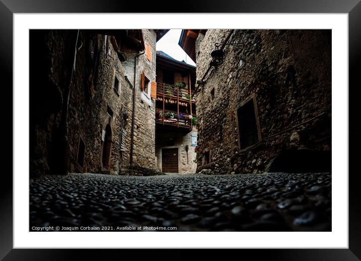 An old stone and rock village with houses still standing in the  Framed Mounted Print by Joaquin Corbalan