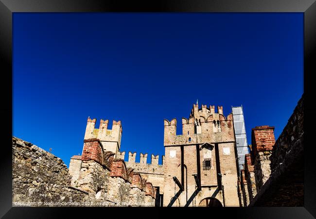 Facade of the castle of Sirmione surrounded by water. Framed Print by Joaquin Corbalan