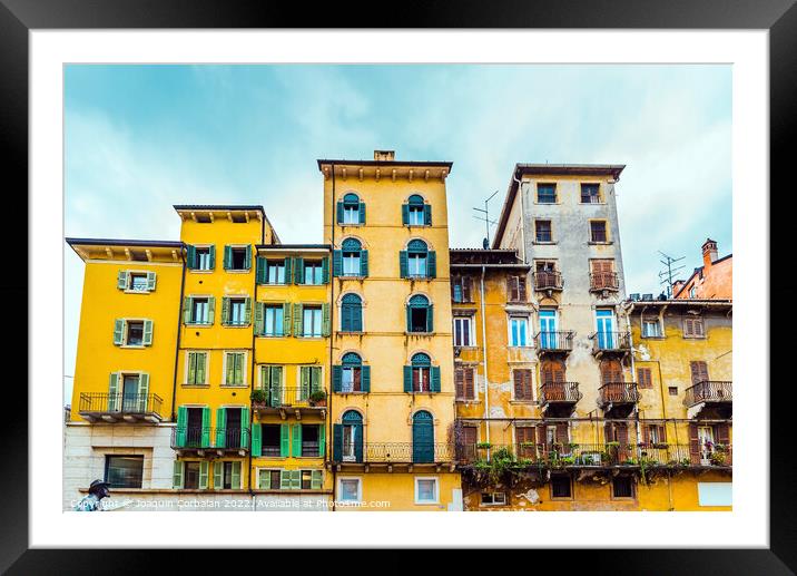 Faded and old facades of houses in the old town of the city of V Framed Mounted Print by Joaquin Corbalan