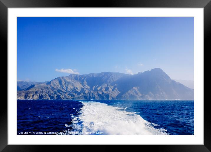 Coast of Gran Canaria and port of Agaete seen from the sea. Framed Mounted Print by Joaquin Corbalan