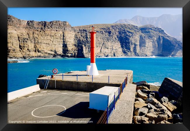 Entrance to the mouth of the port of Agaete with the beautiful c Framed Print by Joaquin Corbalan