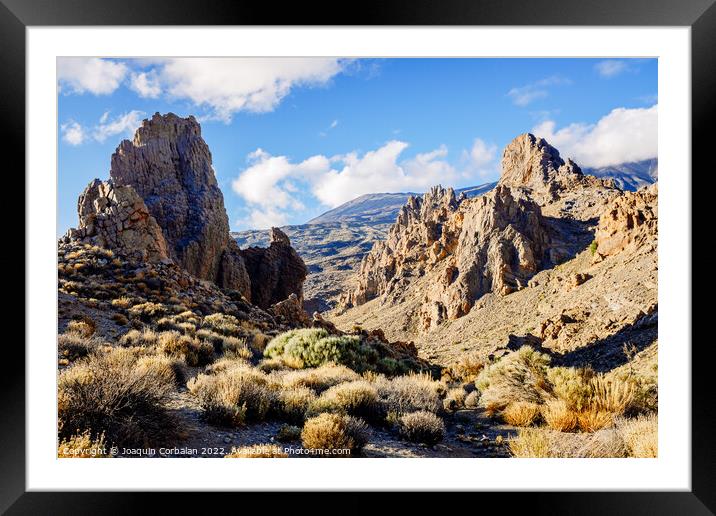 Los Roques are volcanic rock formations in Tenerife, some near t Framed Mounted Print by Joaquin Corbalan