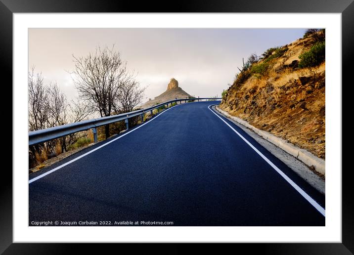 Roque Bentayga seen from the road on a beautiful and misty day Framed Mounted Print by Joaquin Corbalan