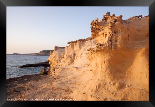 Limestone cliffs debris from erosion turns into white beach sand Framed Print by Joaquin Corbalan