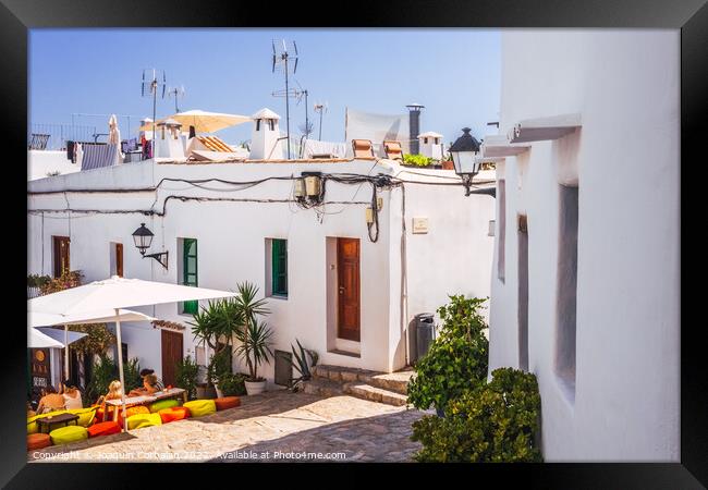 Traditional Ibizan houses, with whitewashed walls to combat the  Framed Print by Joaquin Corbalan