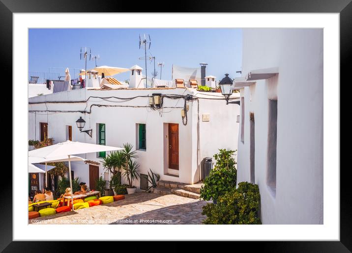 Traditional Ibizan houses, with whitewashed walls to combat the  Framed Mounted Print by Joaquin Corbalan