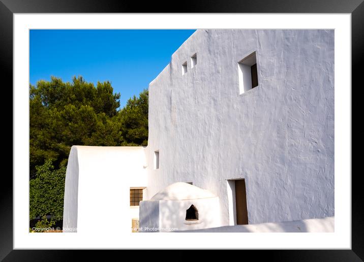 Traditional Ibizan houses, with whitewashed walls to combat the  Framed Mounted Print by Joaquin Corbalan