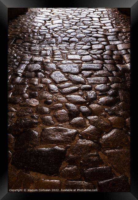 Ancient roman pavement with smooth stones, background and textur Framed Print by Joaquin Corbalan