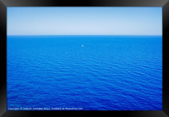 Intense blue sea, relaxing background of the coast seen from abo Framed Print by Joaquin Corbalan
