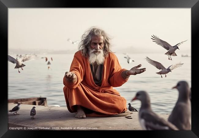 A yogi in an orange robe with a long beard, legs crossed, reflec Framed Print by Joaquin Corbalan